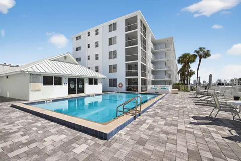 a front view of a house with a swimming pool