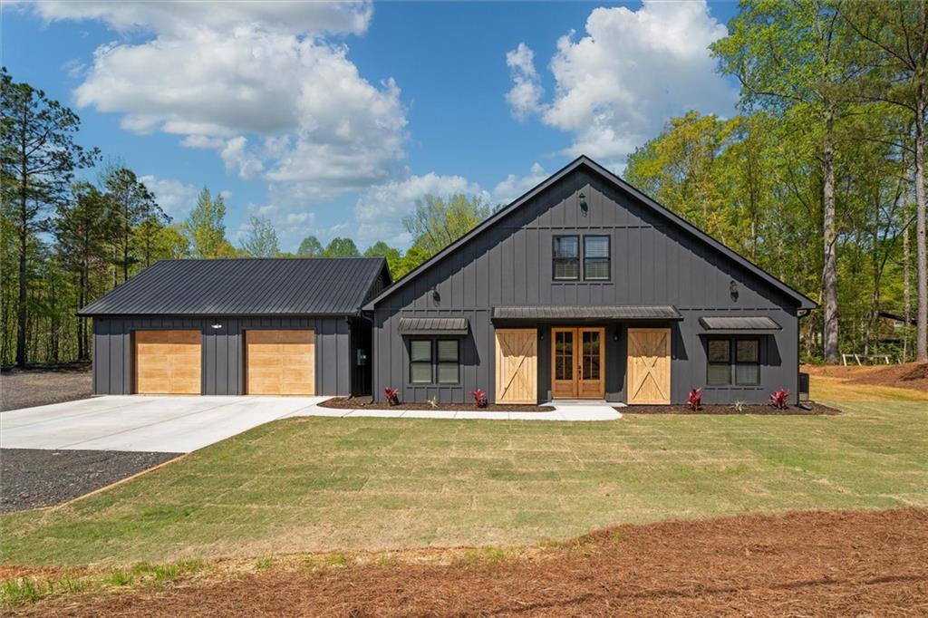 80 Taylors Gin Road Temple, GA 30179 - Photo 1 of 1 a front view of house with yard and trees around