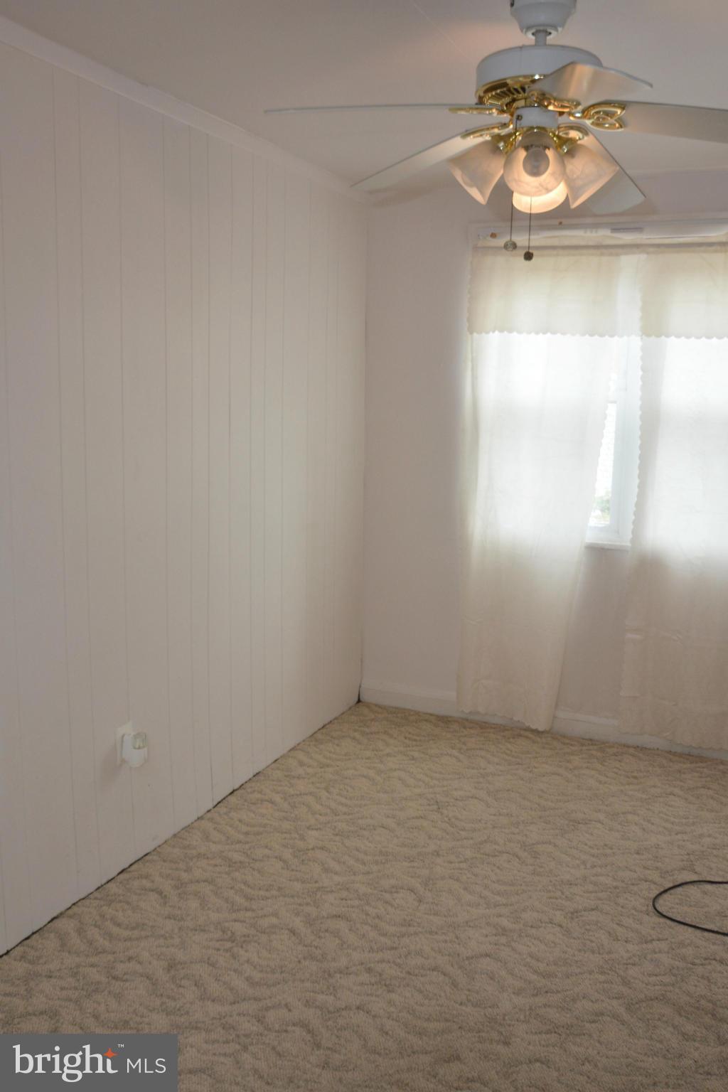 1929 Haselmere Road Baltimore, MD 21222 - Photo 4 of 22 a view of an empty room and window