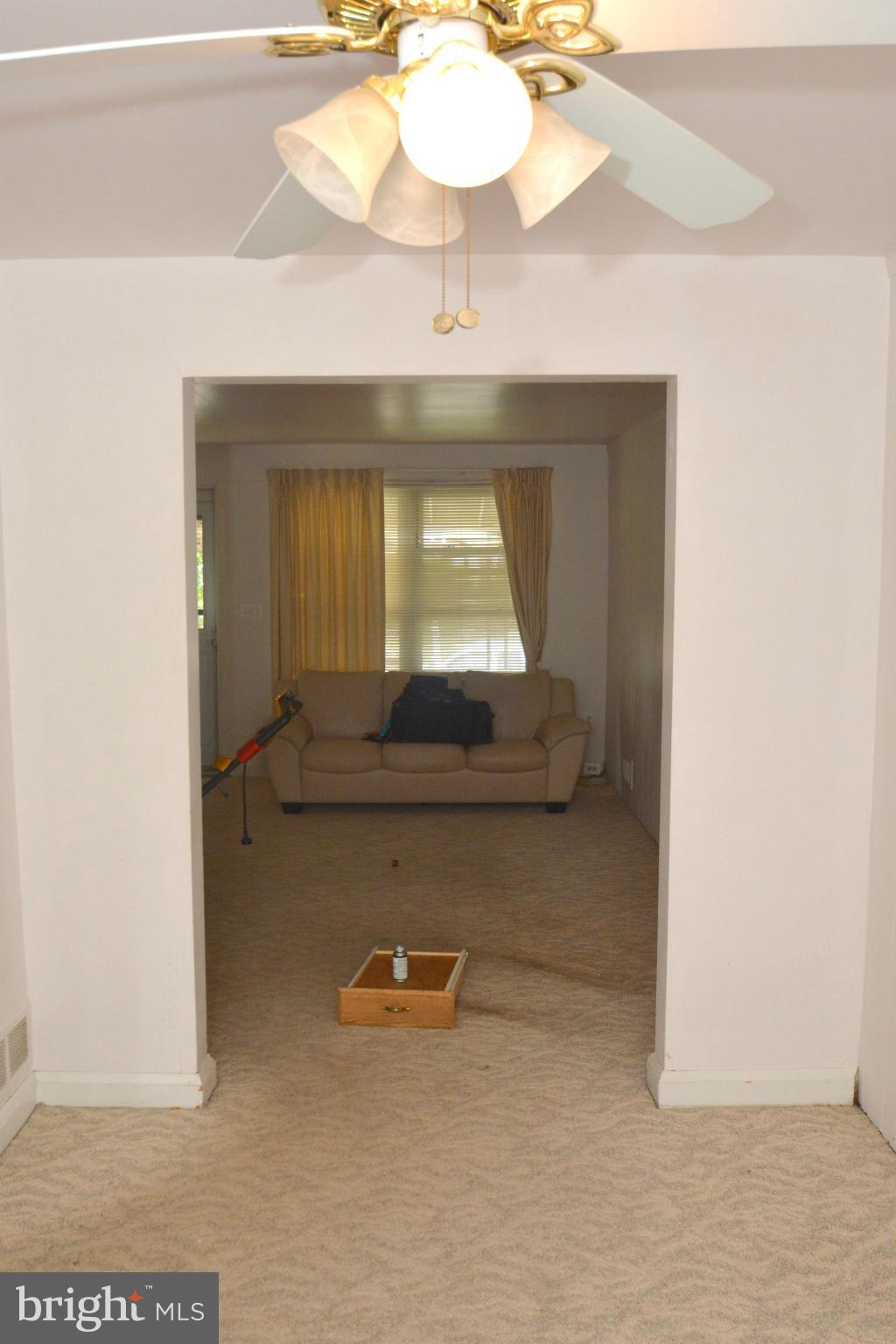 1929 Haselmere Road Baltimore, MD 21222 - Photo 5 of 22 a view of a room with wooden floor and a table