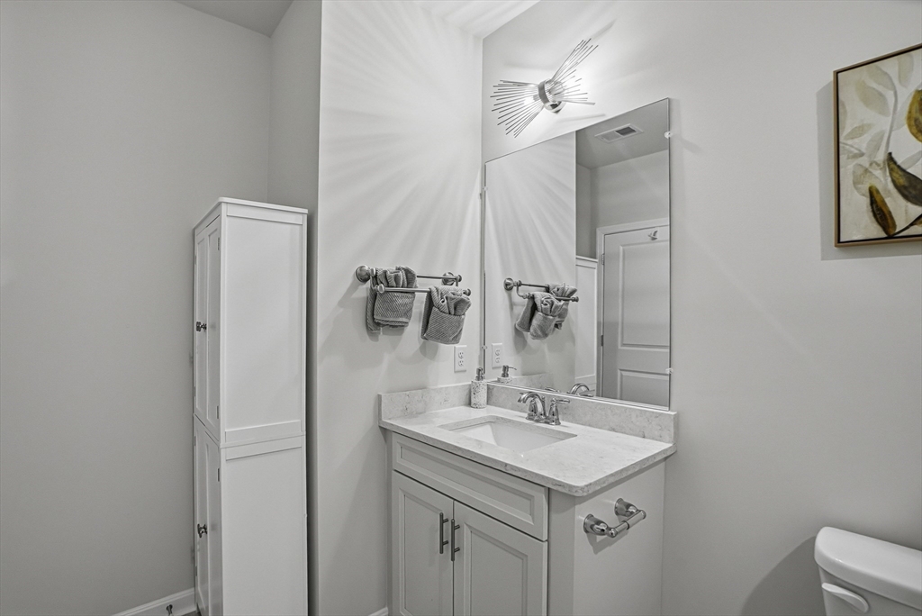 2 Codman Way, Unit 2203 Westborough, MA 01581 - Photo 14 of 36 a bathroom with a sink vanity and a mirror