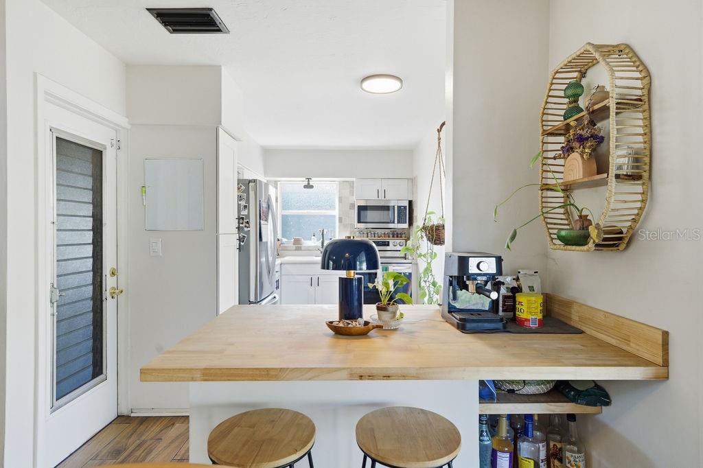 8520 109th Way North Seminole, FL 33772 - Photo 14 of 40 a dining room with table and chairs