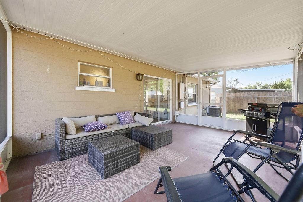 8520 109th Way North Seminole, FL 33772 - Photo 20 of 40 a living room with furniture and a fireplace