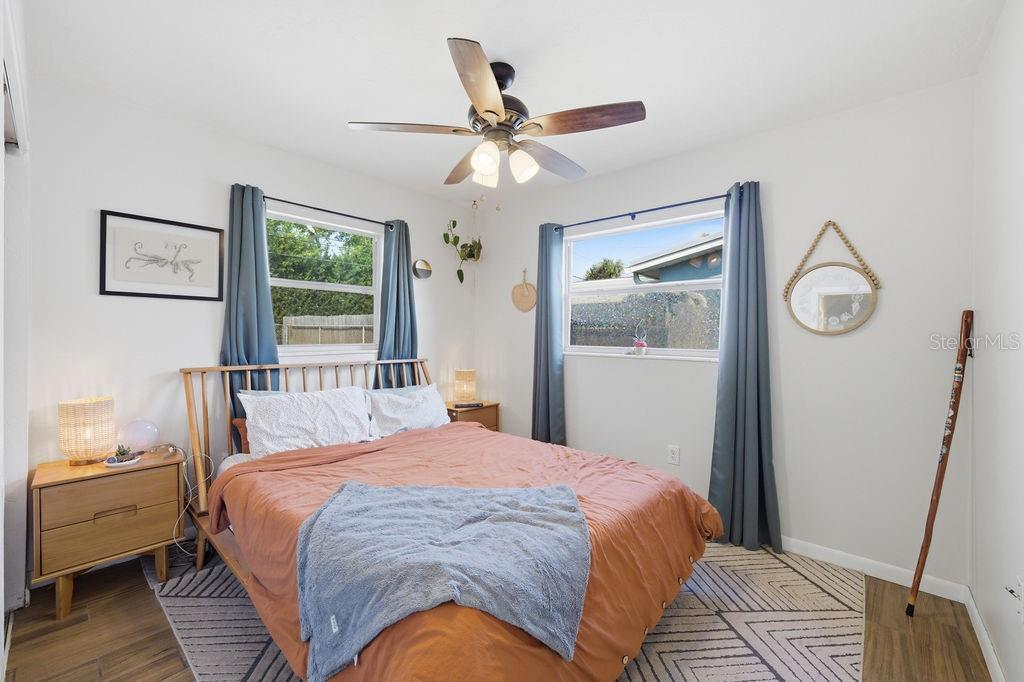 8520 109th Way North Seminole, FL 33772 - Photo 24 of 40 a bedroom with a bed and a window