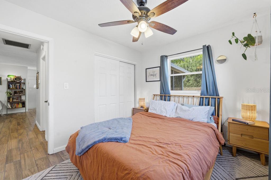 8520 109th Way North Seminole, FL 33772 - Photo 25 of 40 a bedroom with a bed dresser and a window