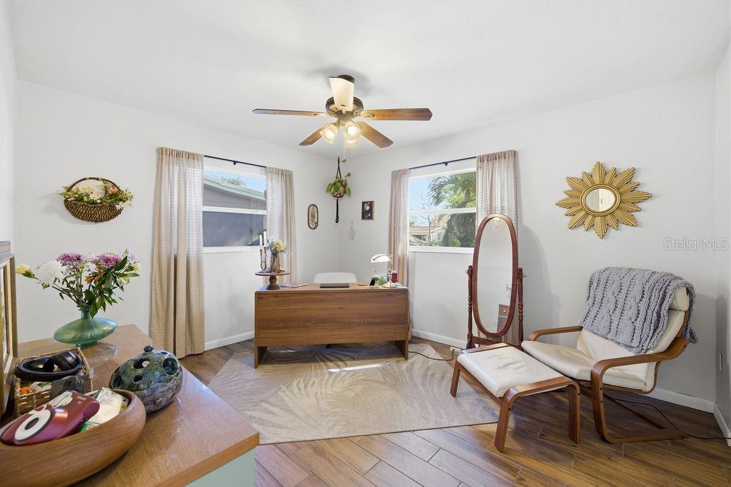 8520 109th Way North Seminole, FL 33772 - Photo 27 of 40 a living room with furniture and wooden floor