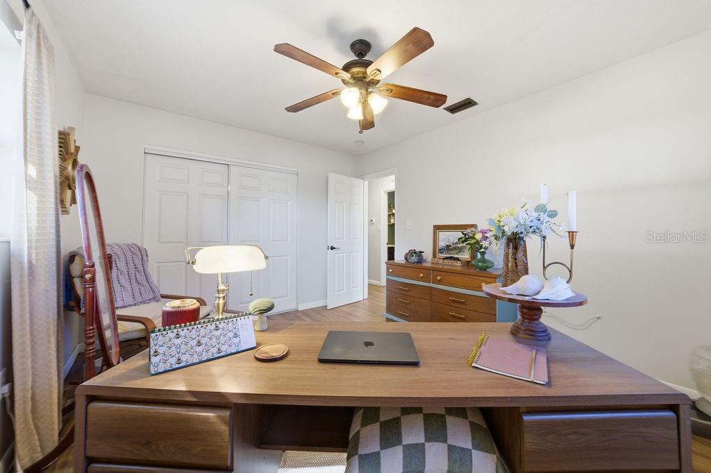 8520 109th Way North Seminole, FL 33772 - Photo 28 of 40 a living room with furniture and a chandelier