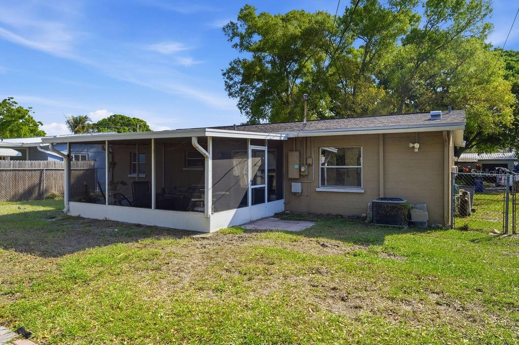 8520 109th Way North Seminole, FL 33772 - Photo 33 of 40 a view of a house with a yard and a garden