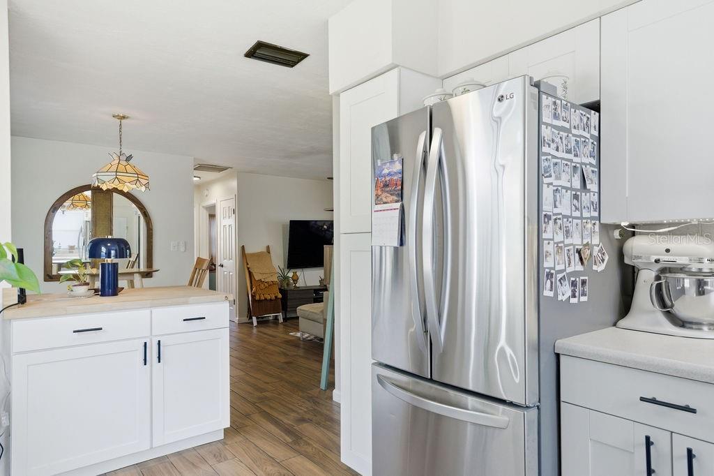 8520 109th Way North Seminole, FL 33772 - Photo 8 of 40 a kitchen with a refrigerator and a sink