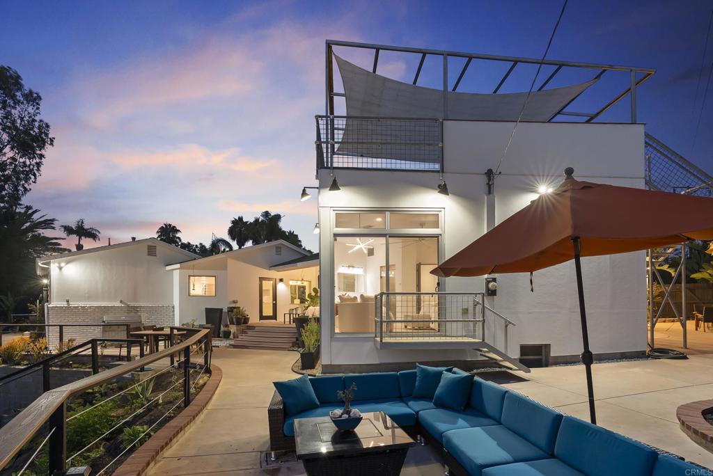 a outdoor space with patio a couch and chairs