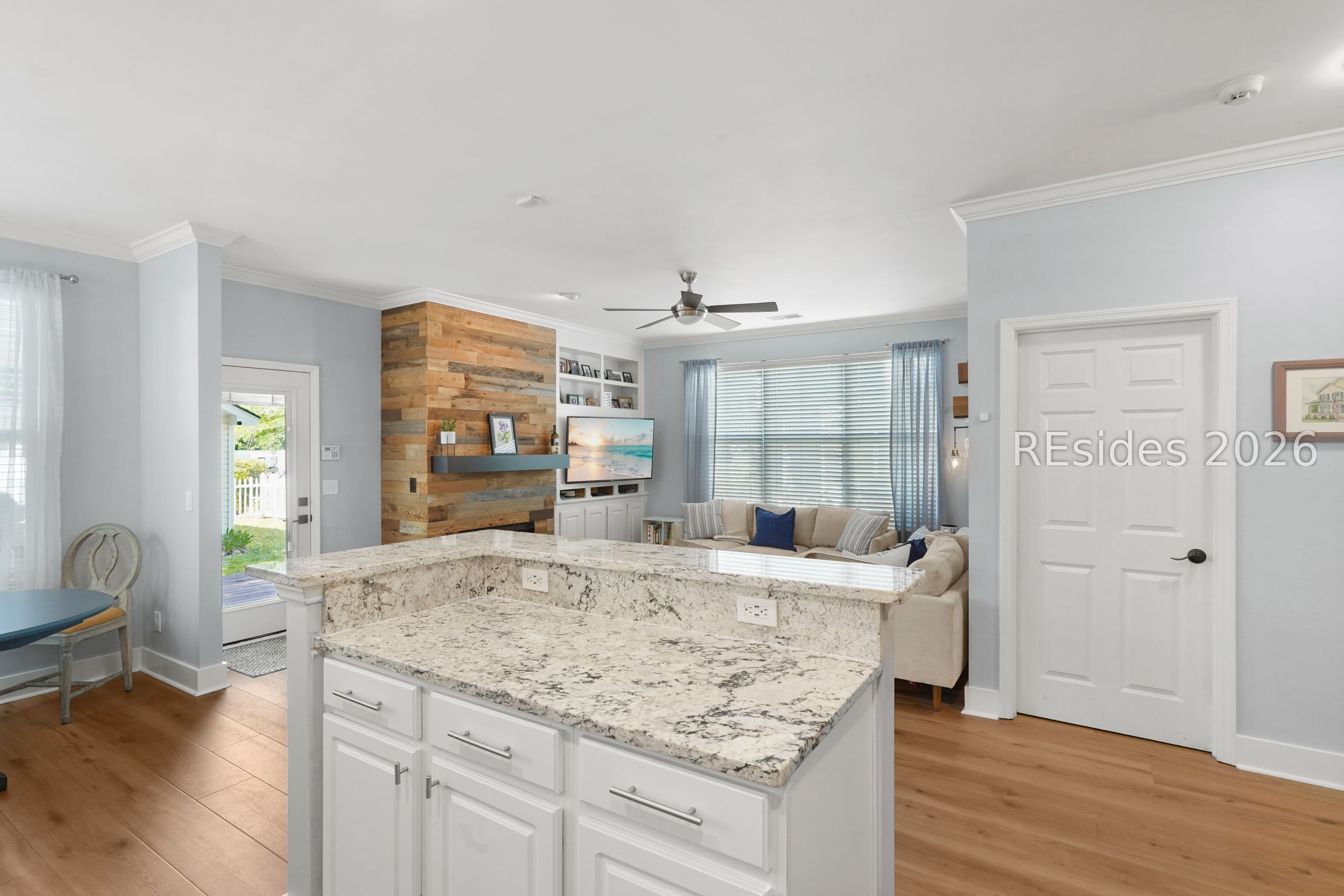 47 5th Avenue Bluffton, SC 29910 - Photo 13 of 44 Kitchen opens to living room with fireplace