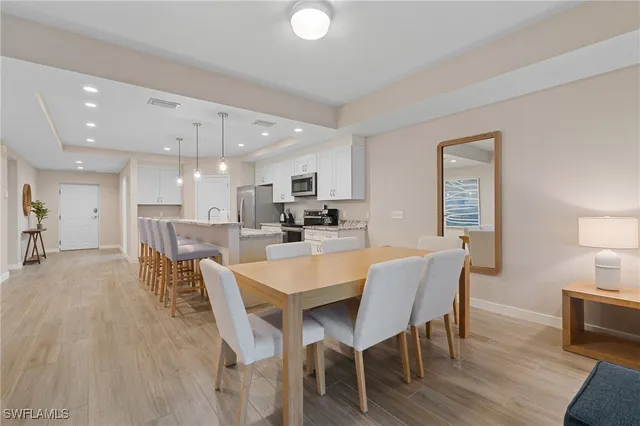 a view of a dining room with furniture and wooden floor