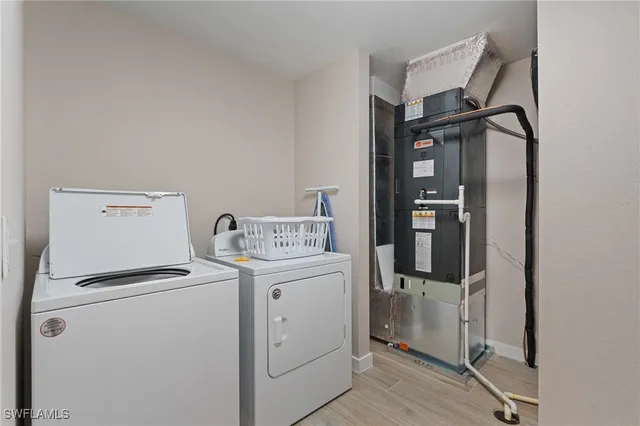 a bedroom with a bed and a night stand