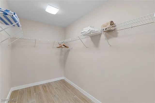 a bathroom with a granite countertop sink mirror vanity and toilet