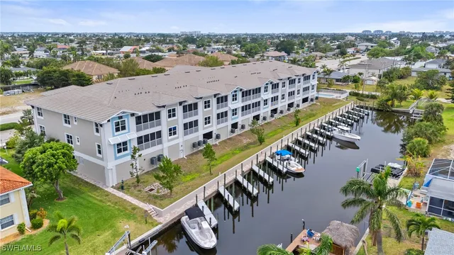 an aerial view of residential houses with city view
