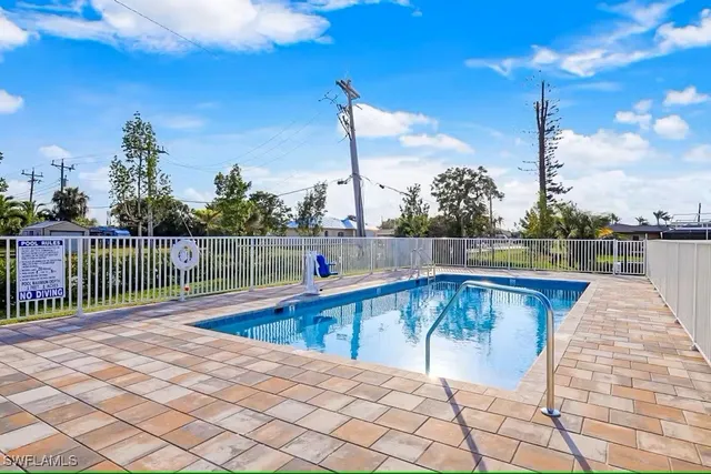 a view of a swimming pool with a lounge chairs
