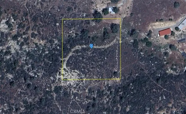 a aerial view of a house with a yard
