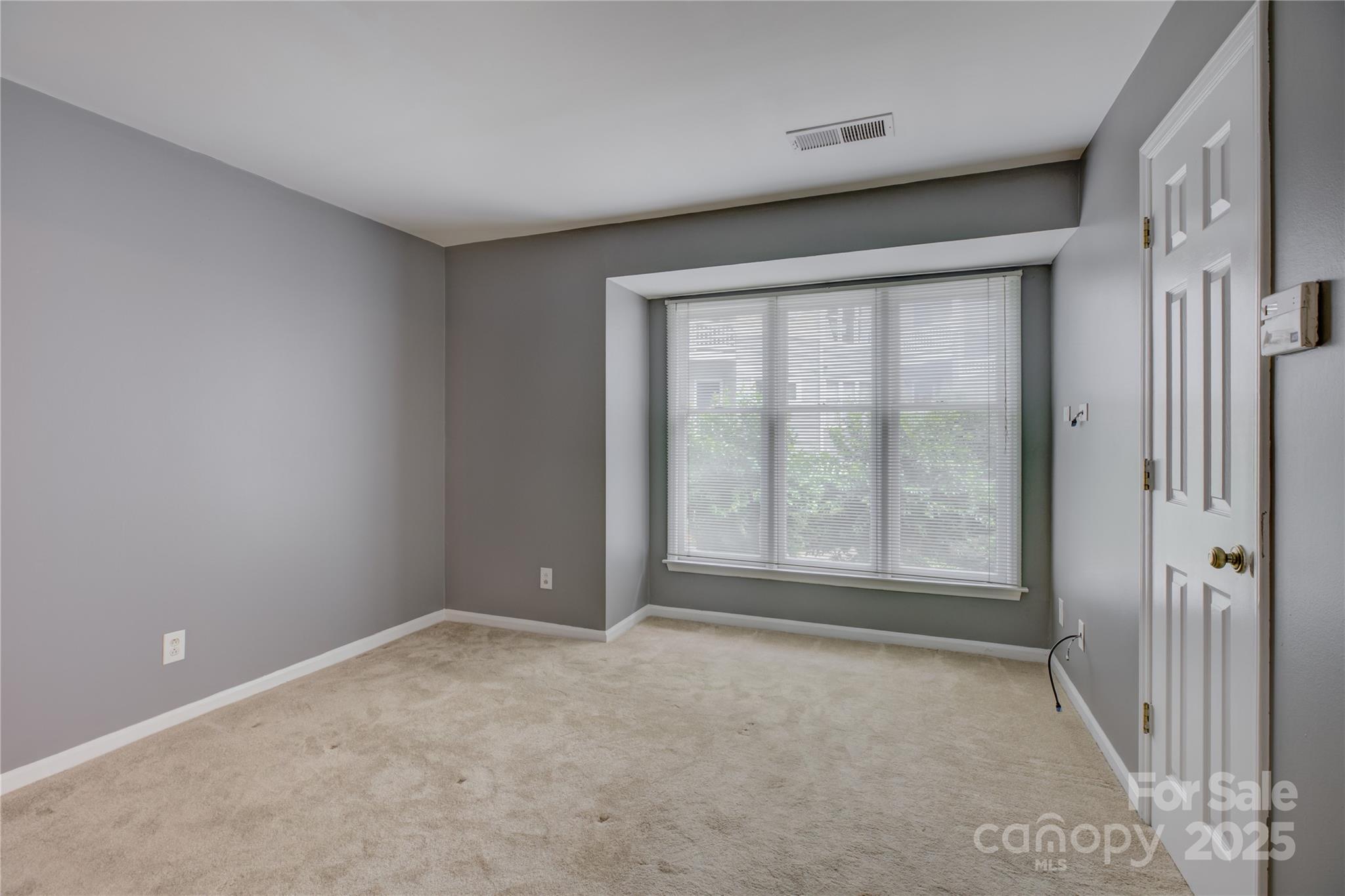 226 Queens Road, Unit 68 Charlotte, NC 28204 - Photo 22 of 40 a view of an empty room with a window