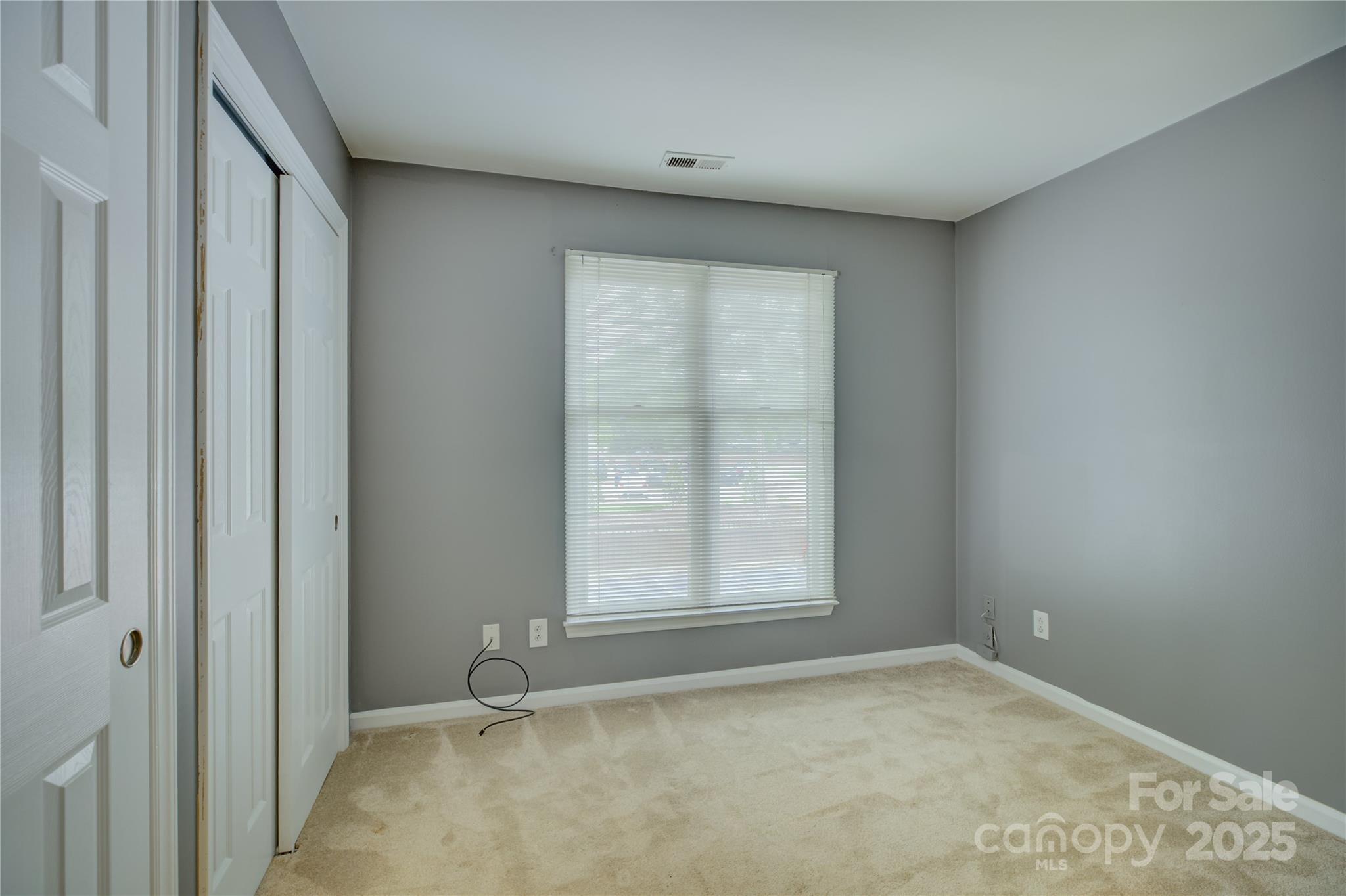226 Queens Road, Unit 68 Charlotte, NC 28204 - Photo 28 of 40 an empty room with a window