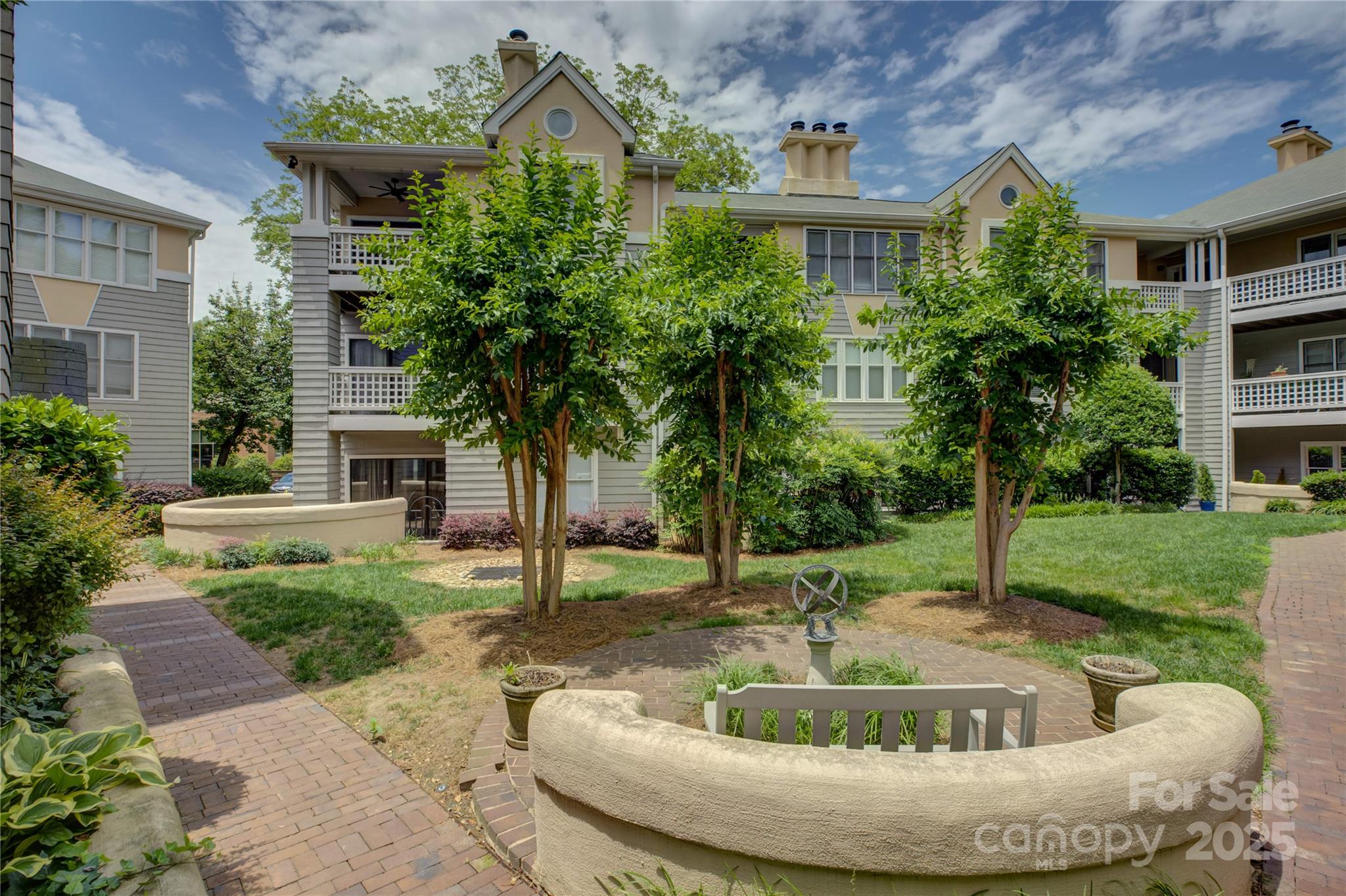 226 Queens Road, Unit 68 Charlotte, NC 28204 - Photo 32 of 40 a view of a house with a yard and plants