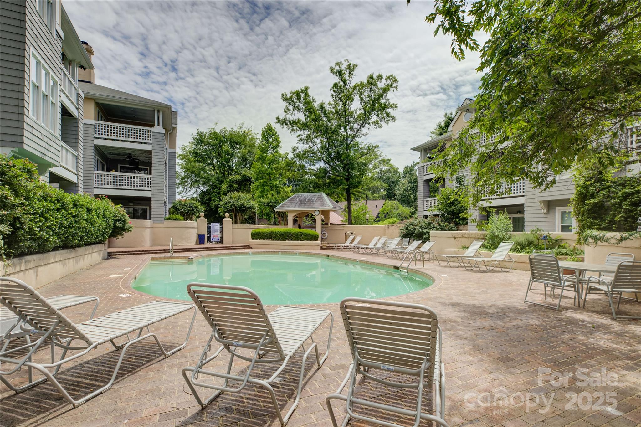226 Queens Road, Unit 68 Charlotte, NC 28204 - Photo 35 of 40 a view of a patio with table and chairs and potted plants