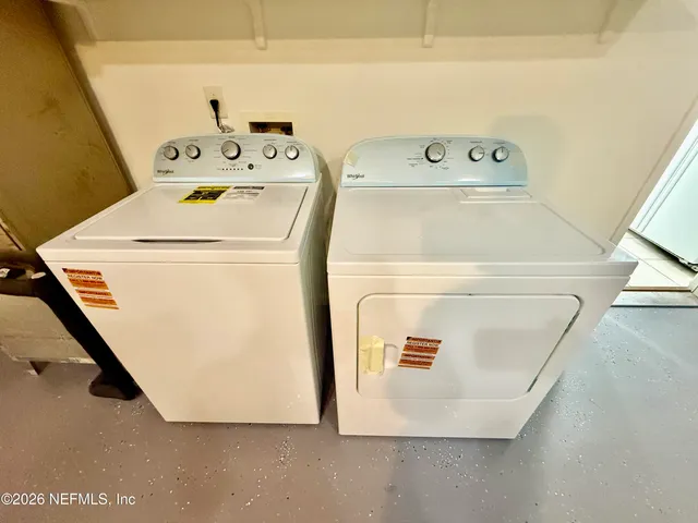 a utility room with dryer and washer