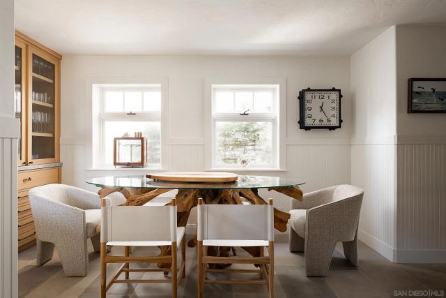 a dining room with furniture and window