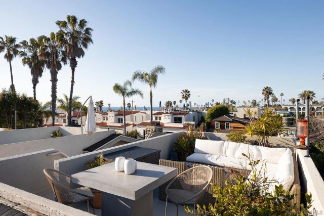 a view of a swimming pool and lounge chairs