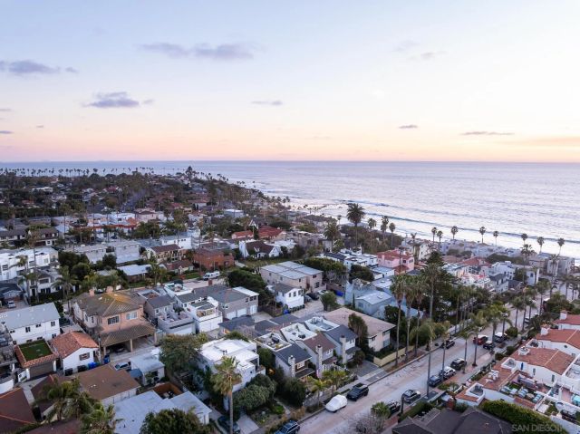 an aerial view of beach and city