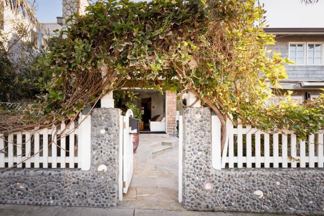 a kitchen with a refrigerator and a stove