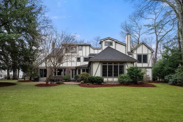 a front view of a house with garden