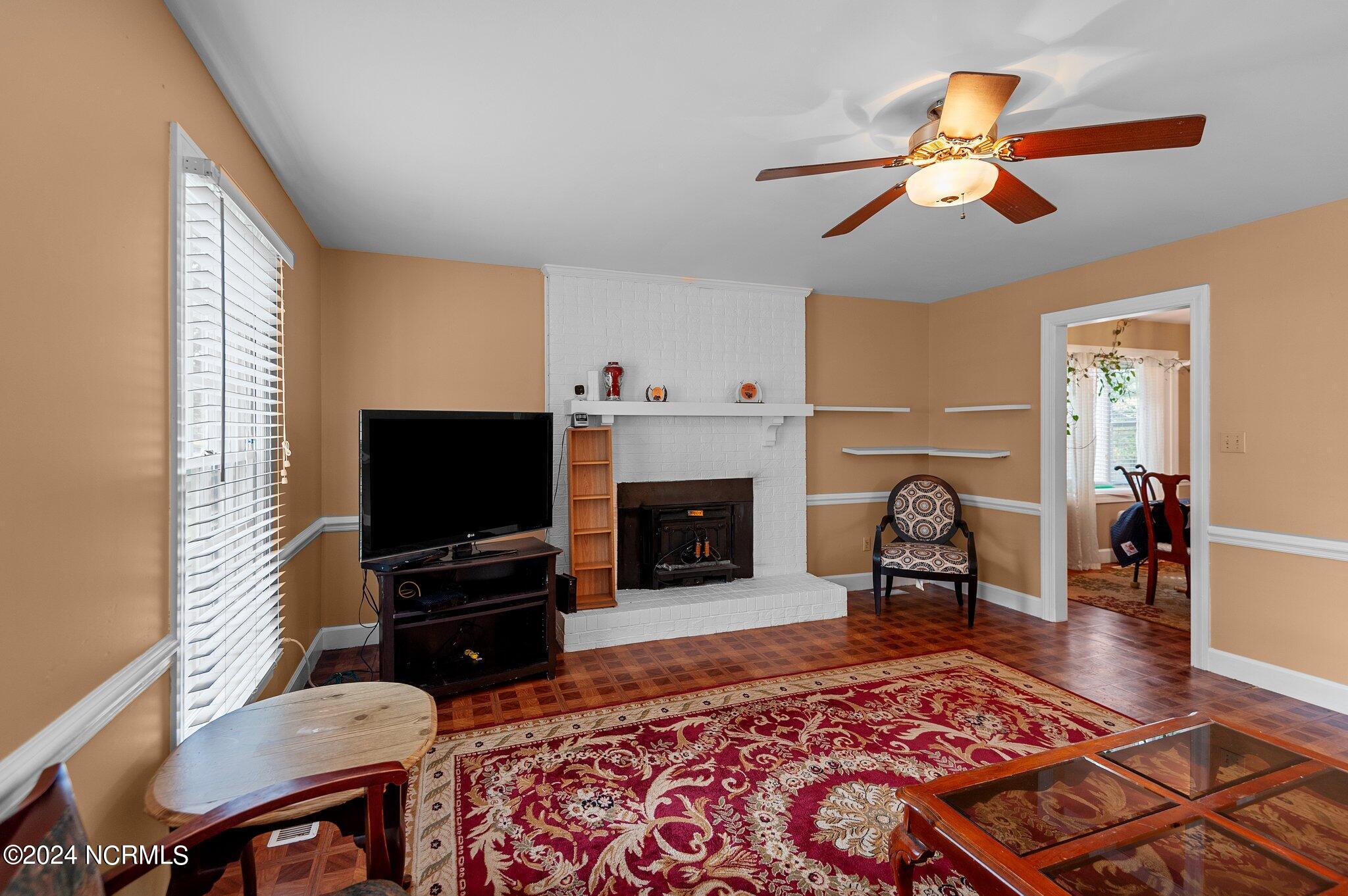 1712 Ridgeway Street West Wilson, NC 27893 - Photo 9 of 55 Fireplace with wood burning insert.