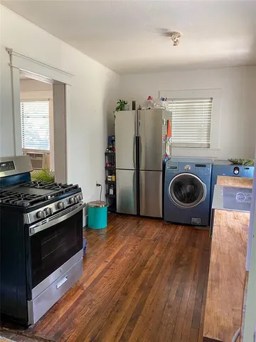 a kitchen with a stove and a refrigerator