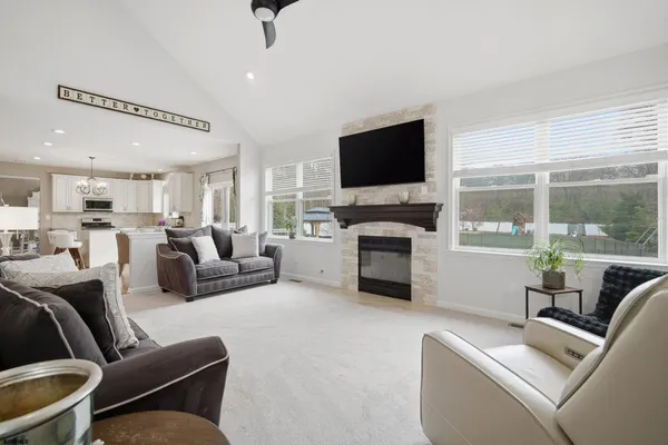 a living room with furniture fireplace and a flat screen tv