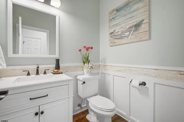 a view of a kitchen with sink washer and dryer