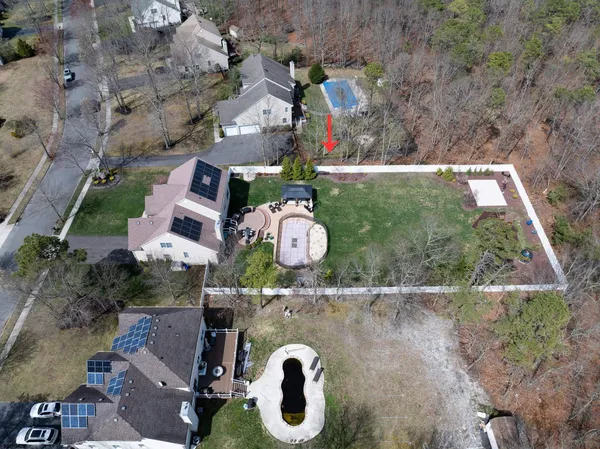 an aerial view of a house with garden space