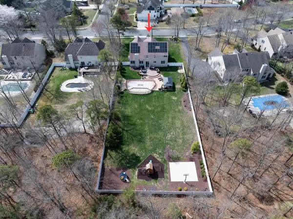 an aerial view of a house with outdoor space