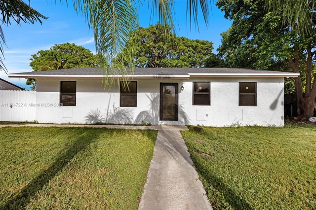 a view of a backyard with plants