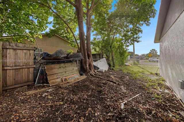 a view of backyard space and tree