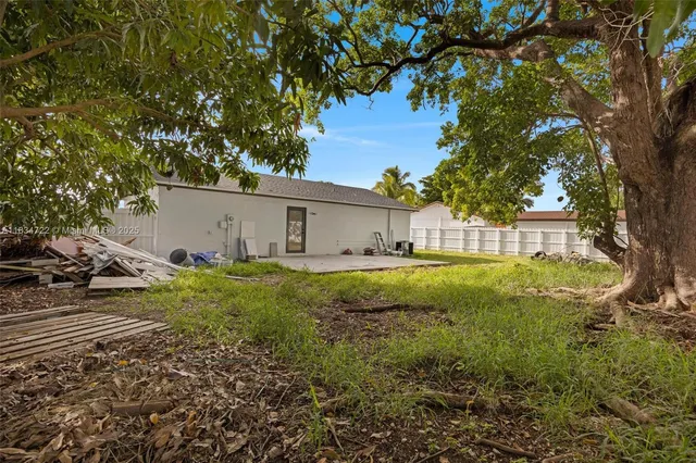 a house view with a backyard space