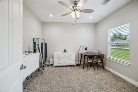 a bathroom with a granite countertop sink tub and a mirror