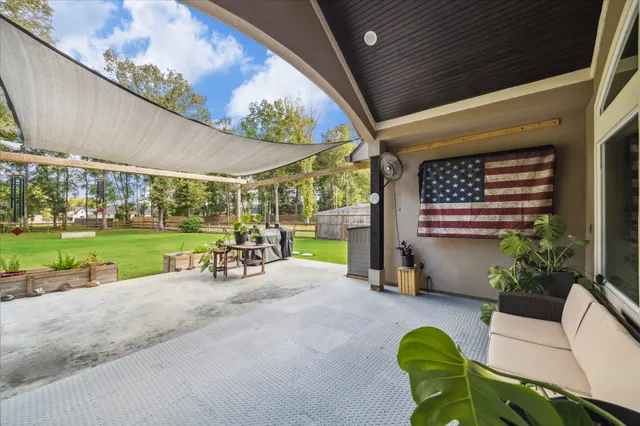 a view of a swimming pool with a patio