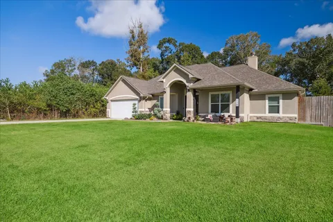 a front view of a house with sitting area
