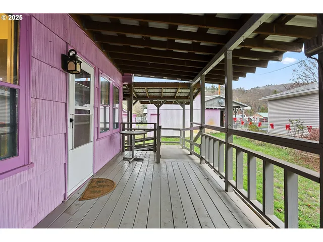 a view of balcony with wooden floor