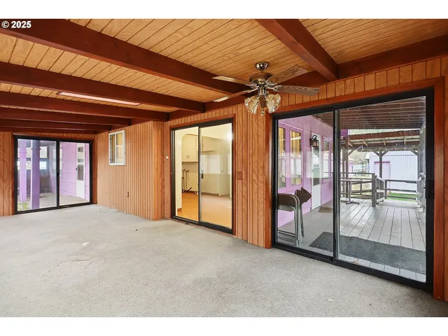a view of an empty room with a sliding door