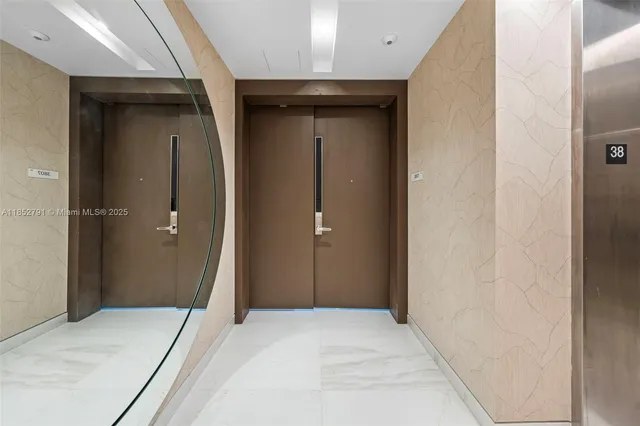 a view of a hallway with wooden shelves