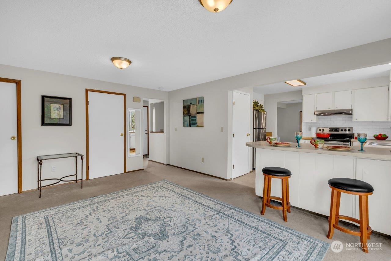 17043 159th Place Southeast Renton, WA 98058 - Photo 14 of 30 a view of kitchen with furniture and refrigerator