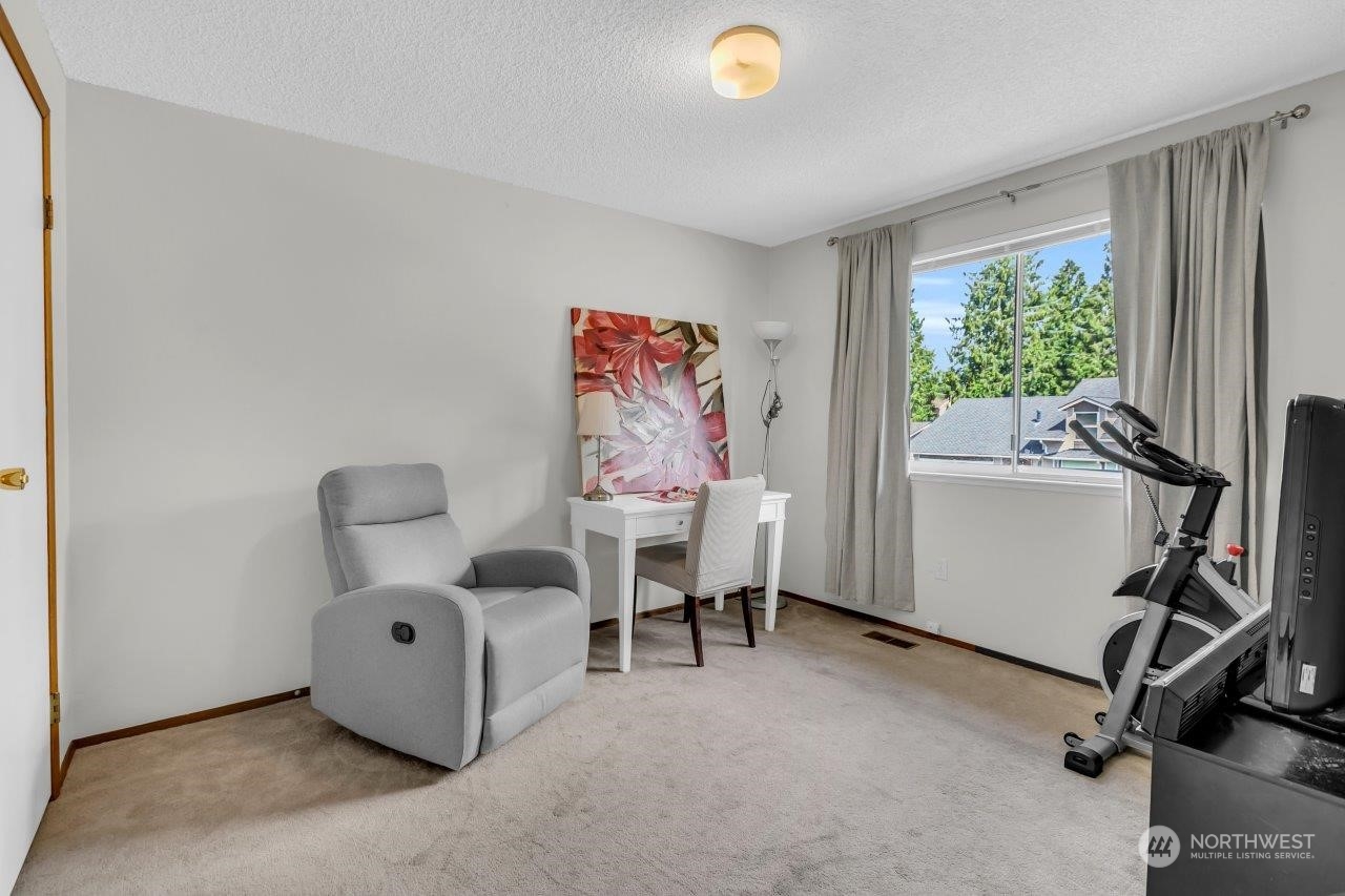 17043 159th Place Southeast Renton, WA 98058 - Photo 18 of 30 a view of a workspace with furniture and a window