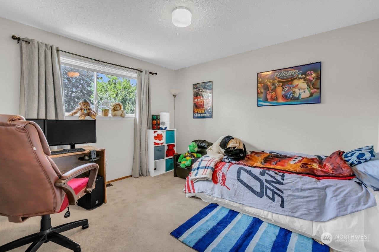 17043 159th Place Southeast Renton, WA 98058 - Photo 20 of 30 a bedroom with furniture and a window