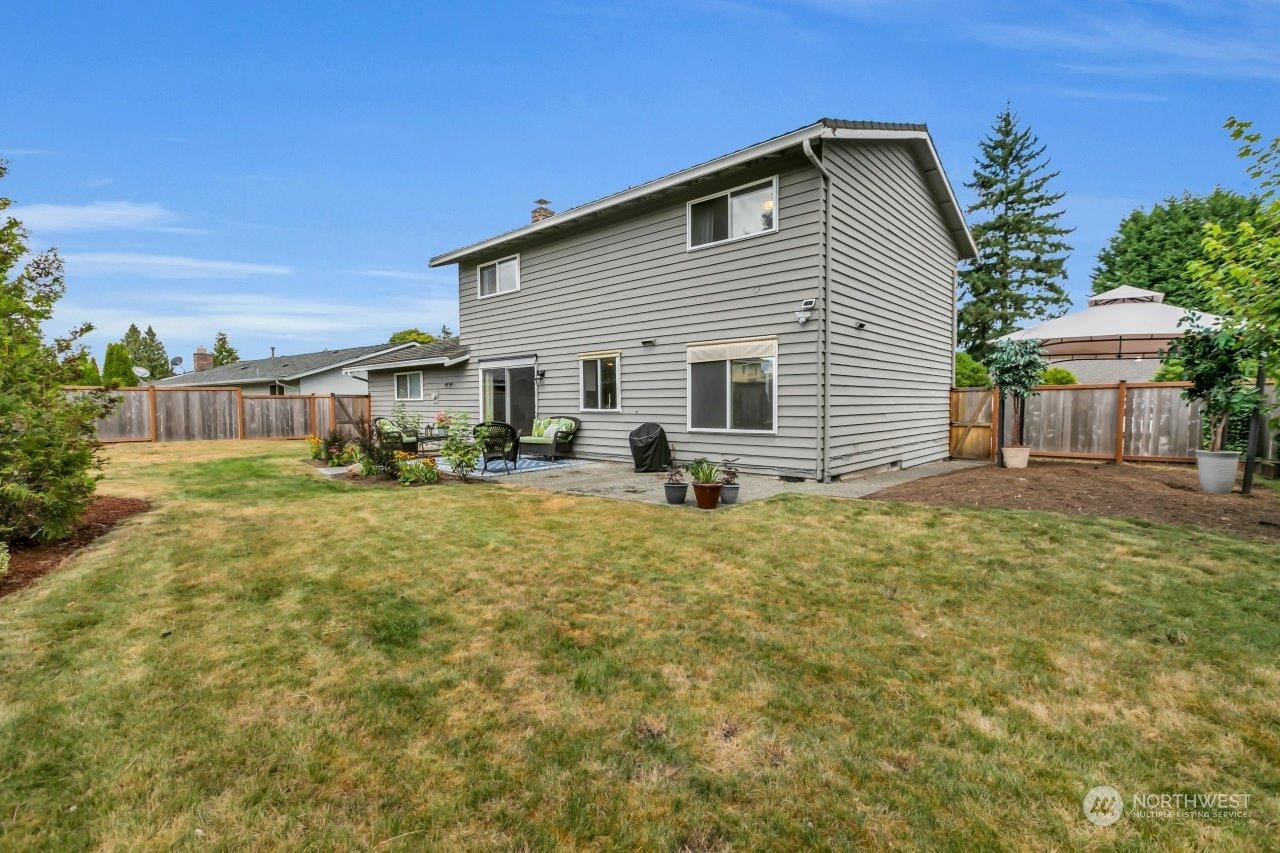 17043 159th Place Southeast Renton, WA 98058 - Photo 26 of 30 a view of a house with backyard and sitting area
